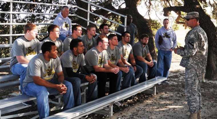 Spartans train football team